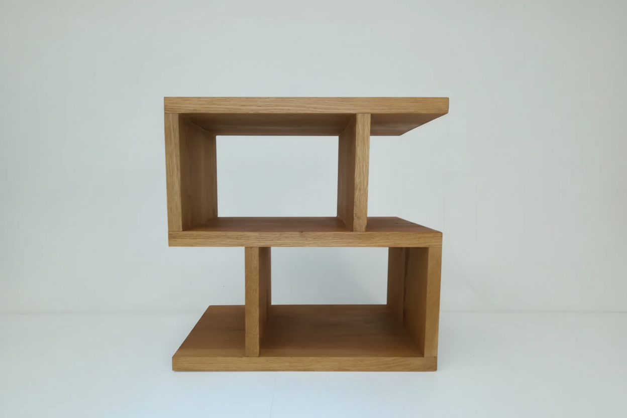 Oak S-shaped shelving unit with studio background